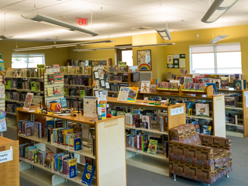 Children's department with many bookcases full of books for children.