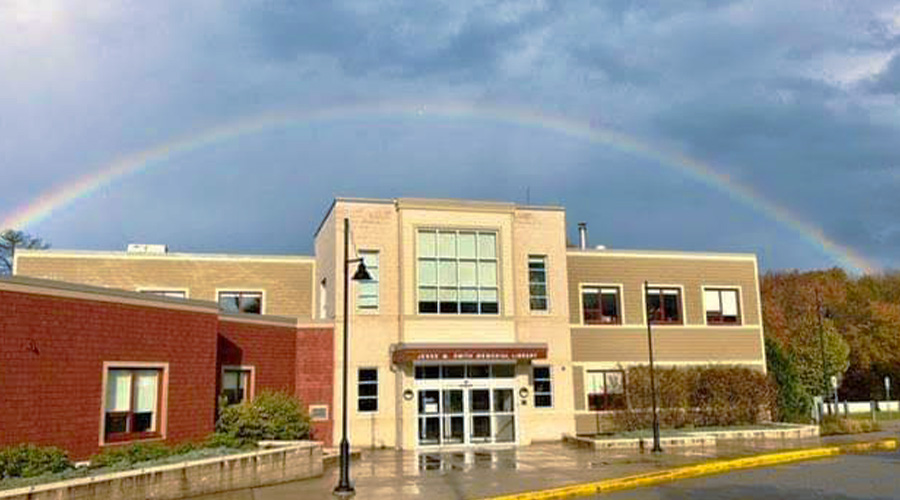 Rainbow over exterior of Jesse M. Smith Memorial Library