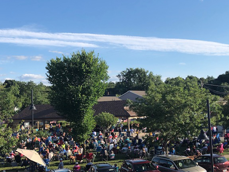 Concert series, aerial shot of a crowd of listeners.