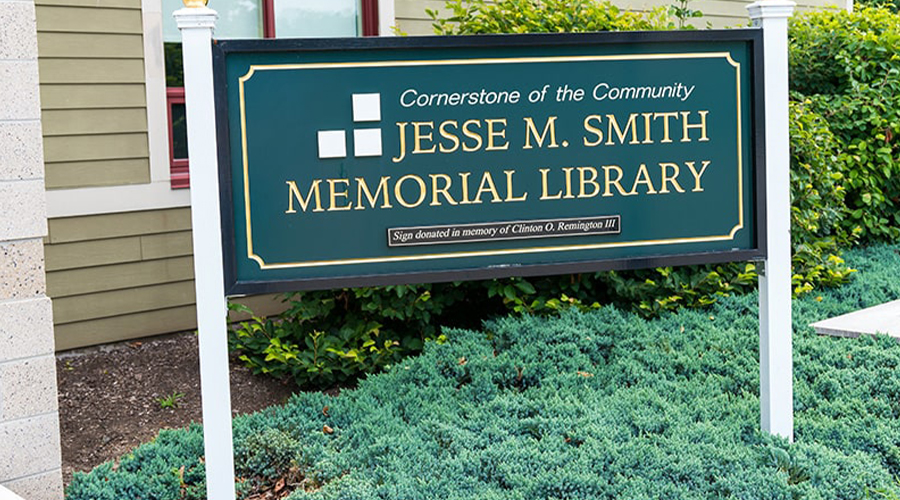 Sign outside of the Jesse M. Smith Memorial Library, featuring the library's name