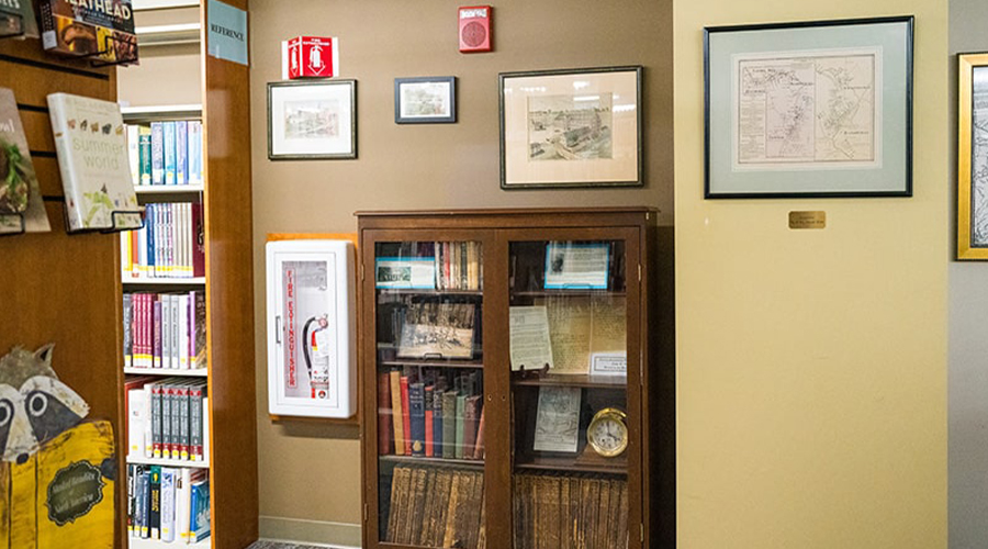 History section of the Jesse M. Smith Memorial Library, featuring historical documents and maps.